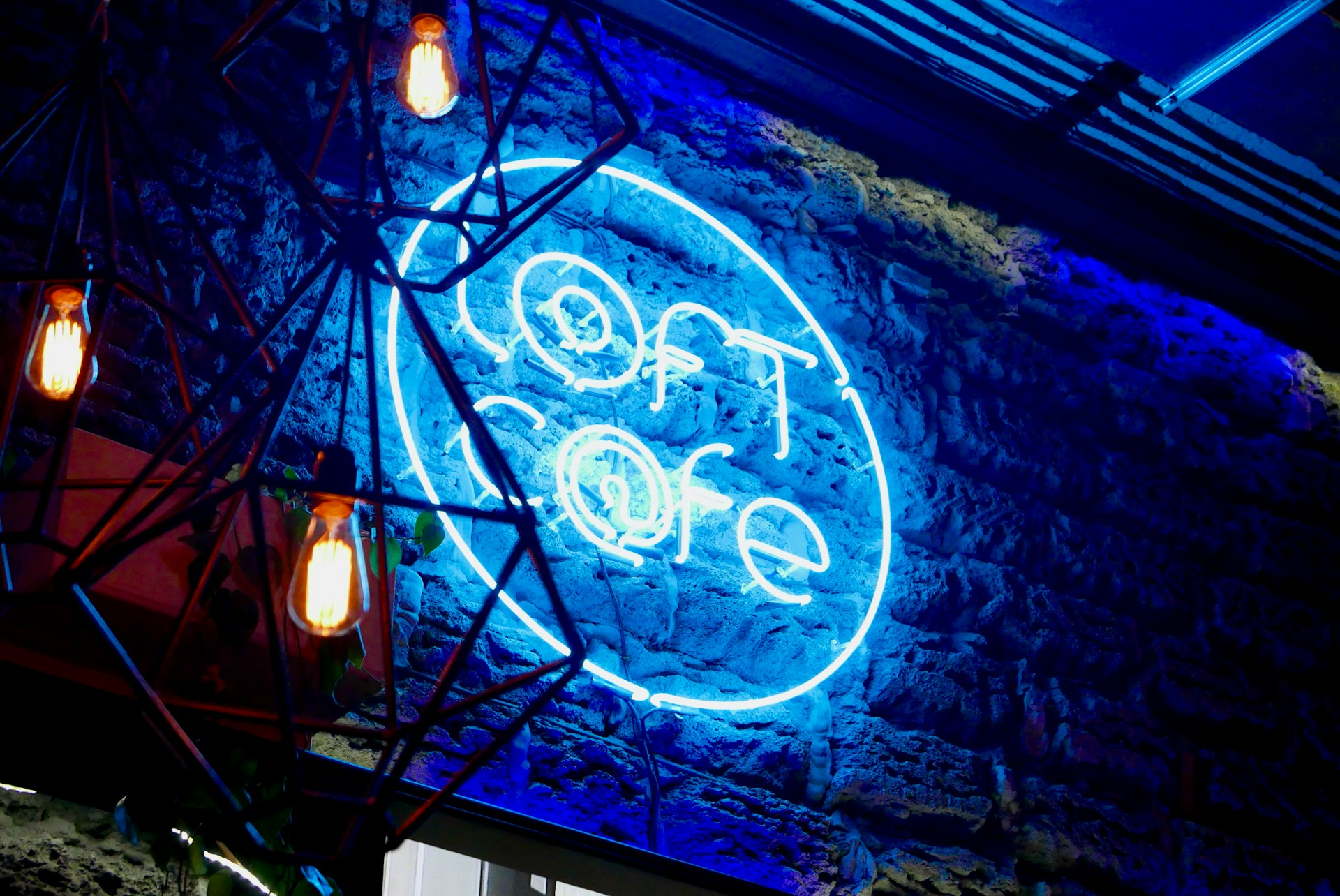 a lighted sign with a blue light